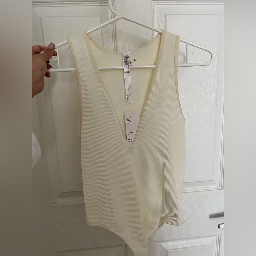Plunge neck ribbed white bodysuit